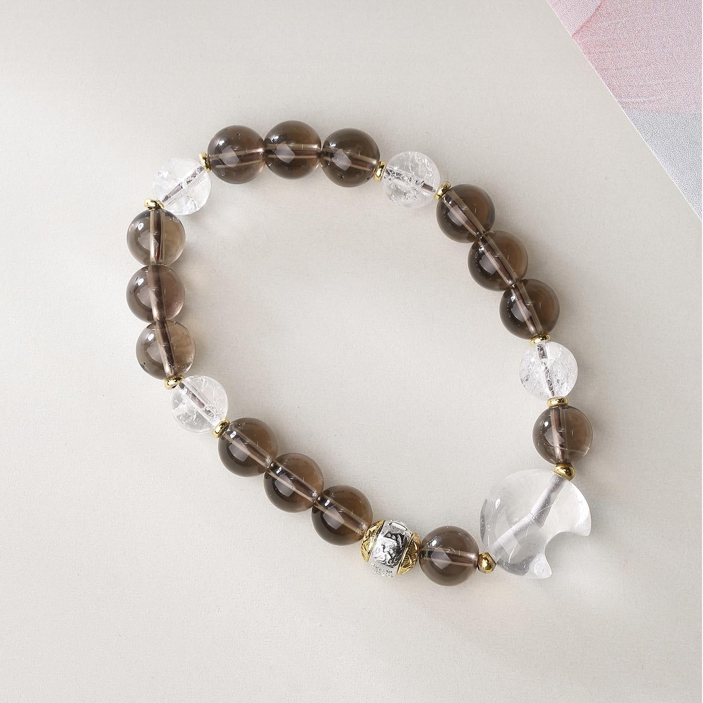 Artisanal Smoky and Clear Crystal beads in Tibetan Buddhist jewelry tradition, hand-painted with sacred geometry for meditation.