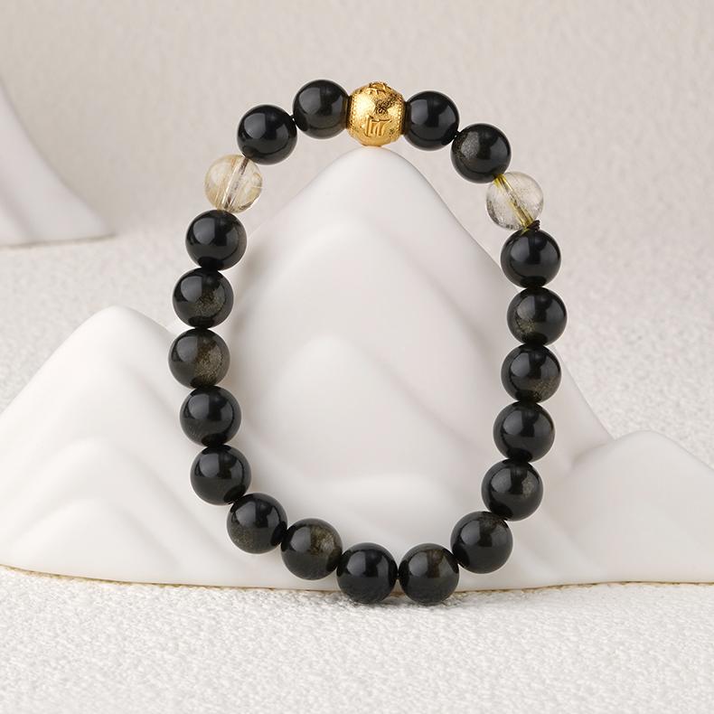  Ink Star Deep Golden Obsidian bracelet with crystal details, embodying Tibetan Buddhist jewelry art for grounding.
