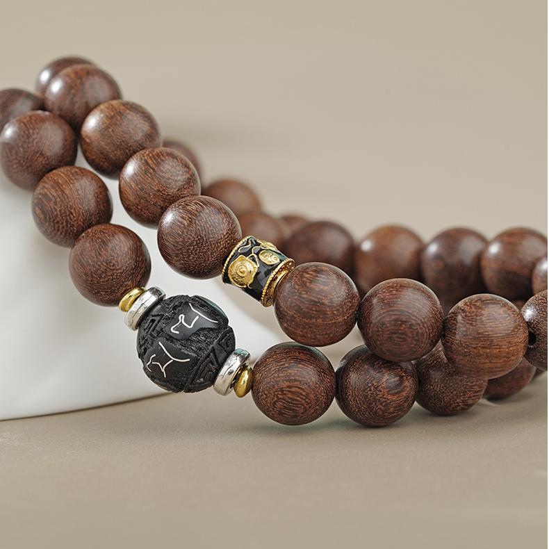 Pure handmade golden sandalwood mala bracelet. Features a smooth, refined surface for comfortable wear, ideal for counting during meditation and mantra recitation to aid focus and attain lasting inner peace.