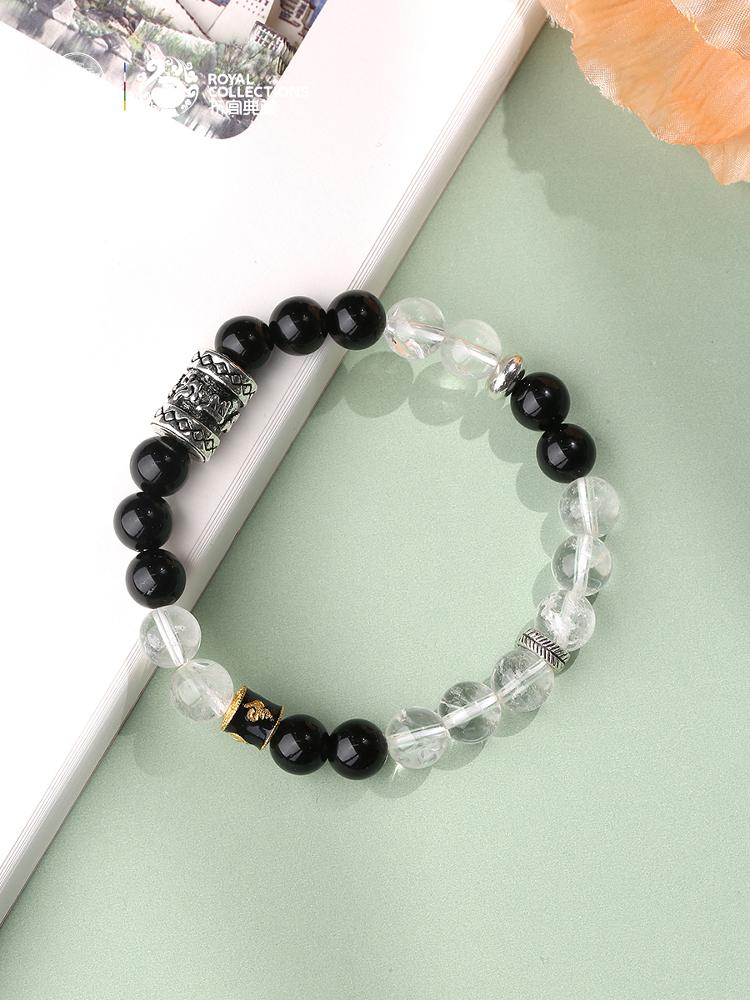 Artisanal Obsidian White Crystal Bracelet set display. Includes bracelet and matching accessories, presenting a complete energy jewelry set that combines spiritual function with fashionable aesthetics.