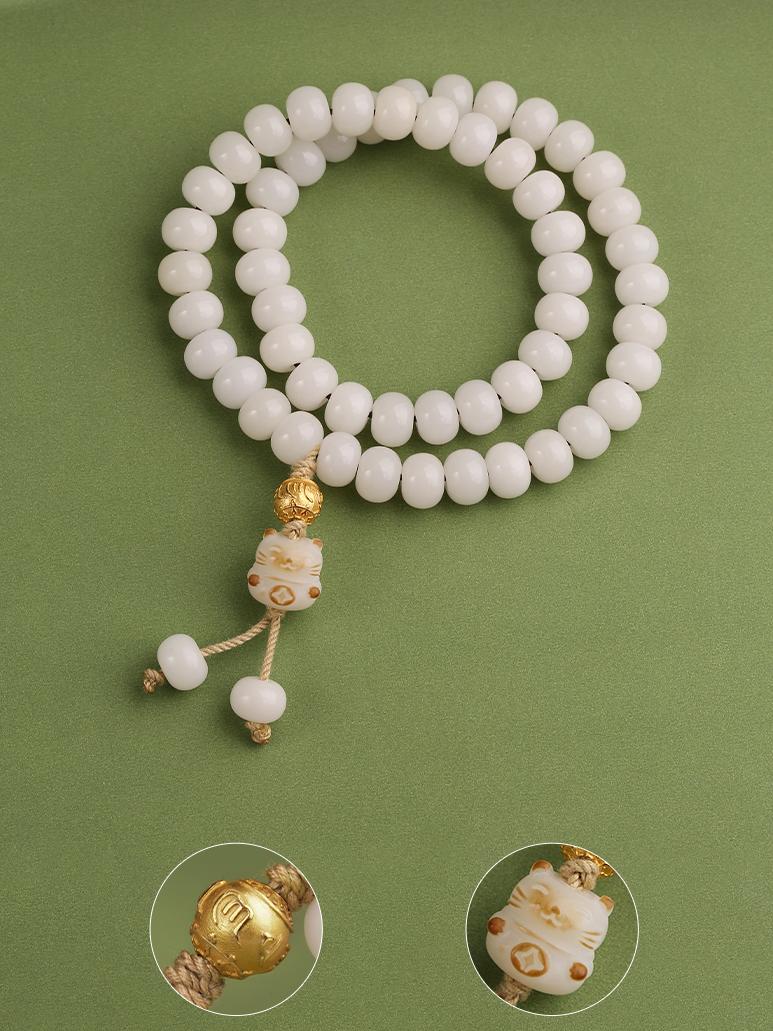 Pure white Bodhi bracelet featuring Tibetan-inspired designs, a beautiful representation of jewelry art from Buddhist culture.