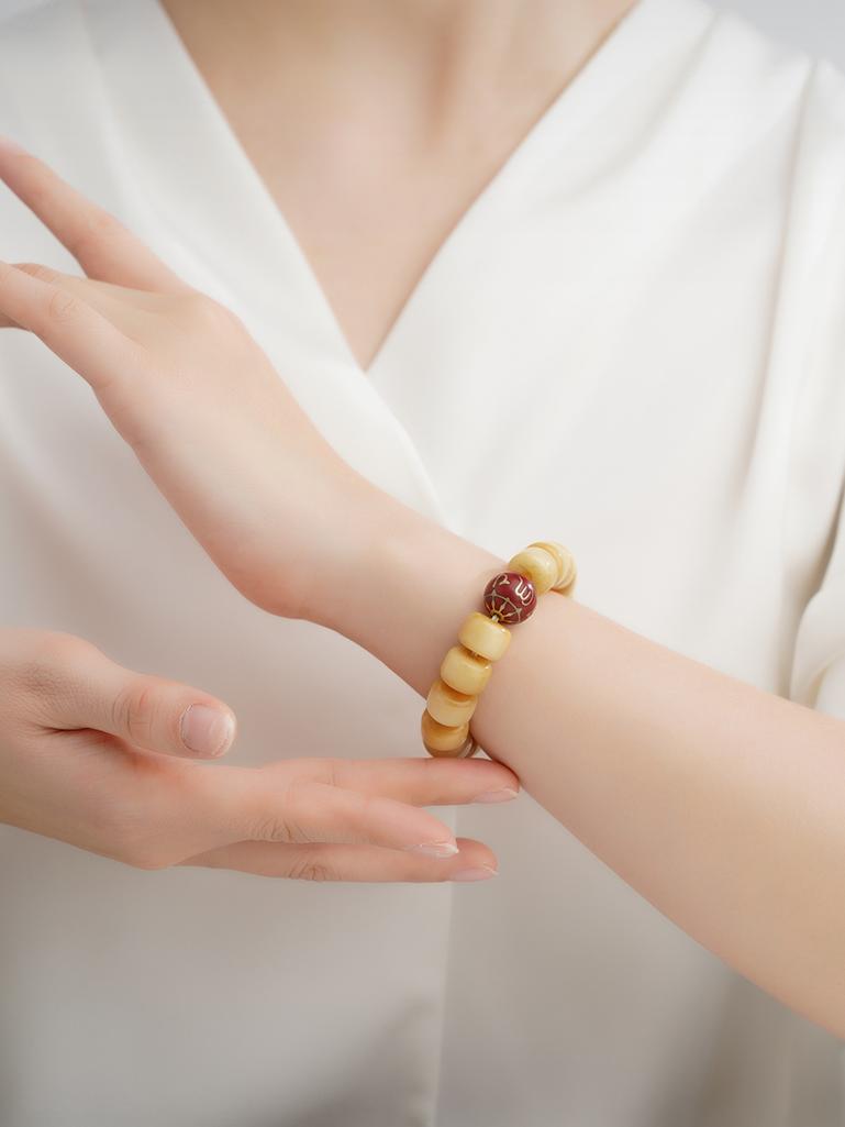 Bone ash mandala beads with sacred geometry in Tibetan Buddhist jewelry tradition, hand-painted with cosmic patterns.
