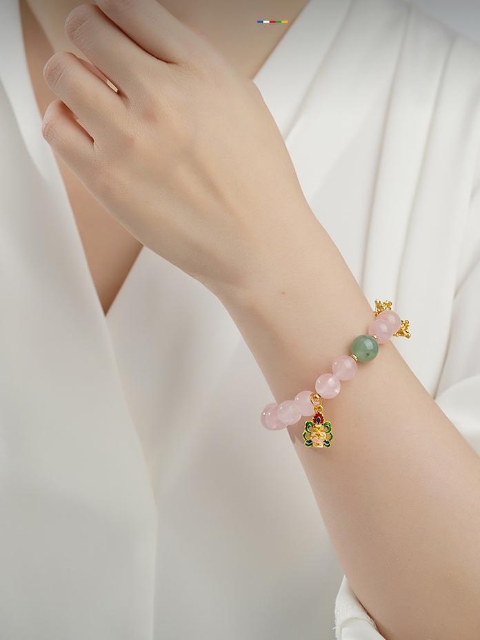 Rose Quartz passion beads with compassion energy, showcasing traditional Tibetan Buddhist jewelry art craftsmanship