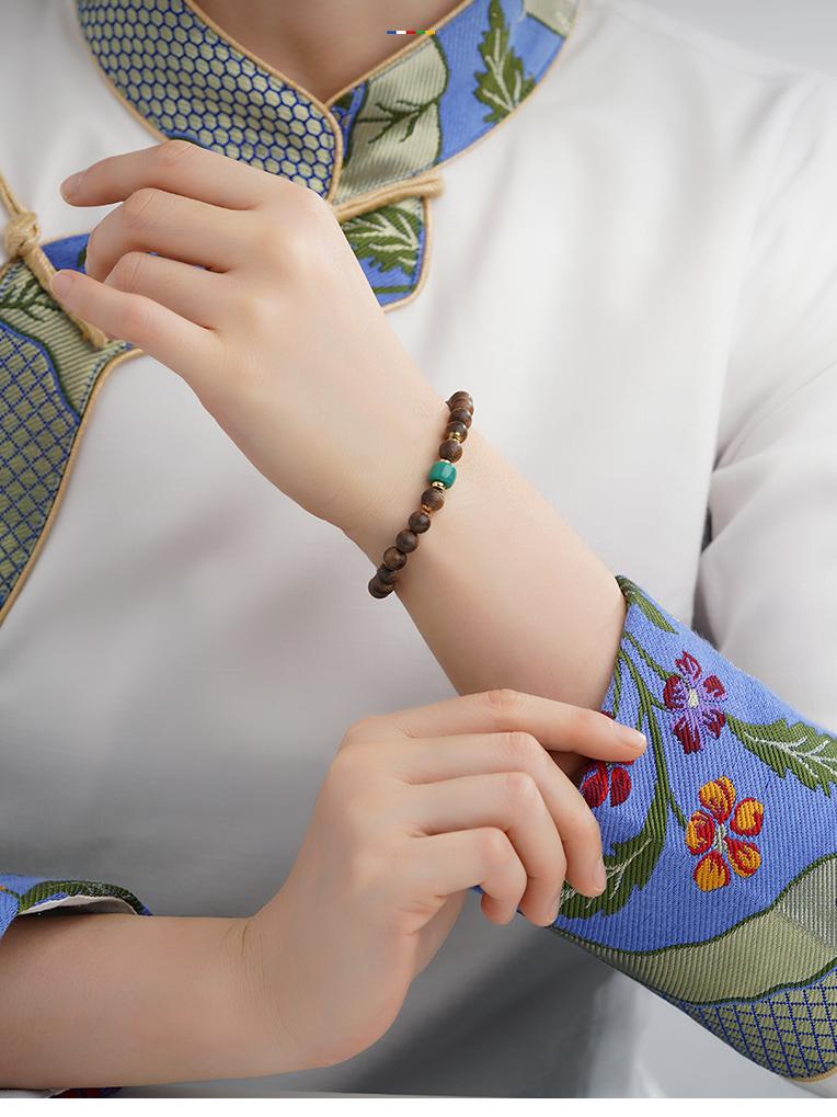 Falling Petals Shadow agarwood bracelet in Tibetan Buddhist jewelry art, symbolizing life's transient beauty and spiritual contemplation.