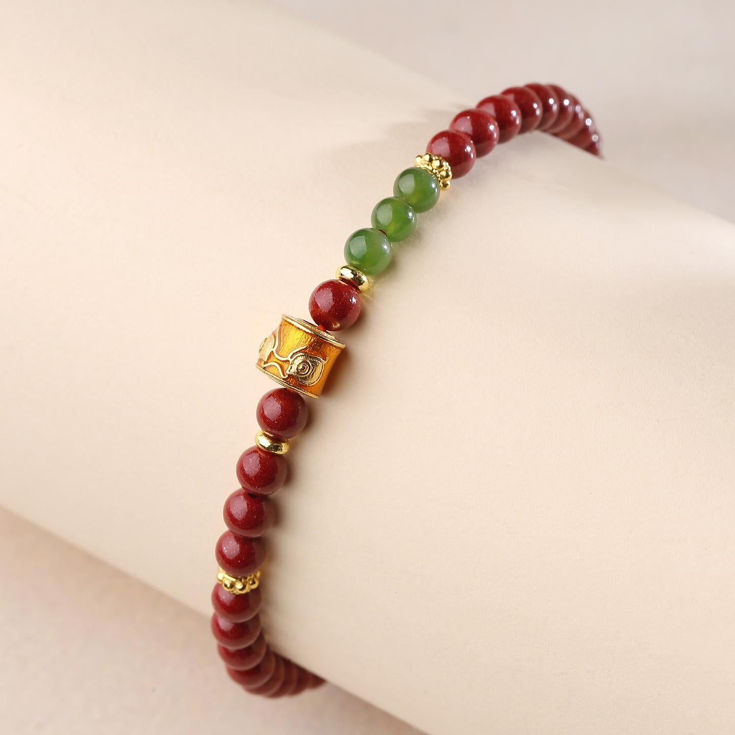 Sacred Cinnabar and Jade design in Tibetan Buddhist jewelry art, embodying celestial protection and timeless spiritual elegance.