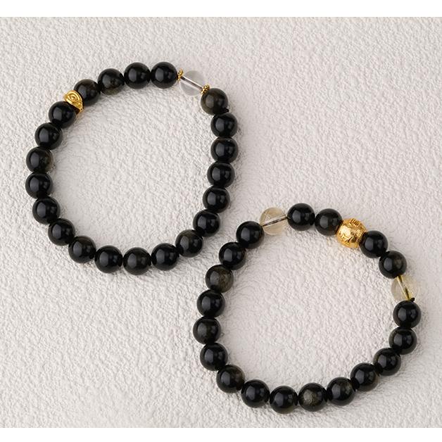 Hand-painted Obsidian and crystal collection for meditation, featuring exquisite Tibetan Buddhist jewelry art.