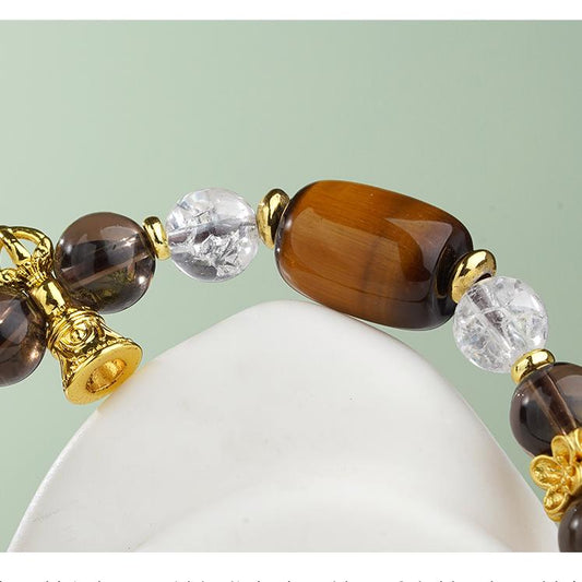 Tibetan Buddhist Tiger's Eye stone mala bracelet for grounding energy meditation, representing spiritual jewelry art with earthy tones.