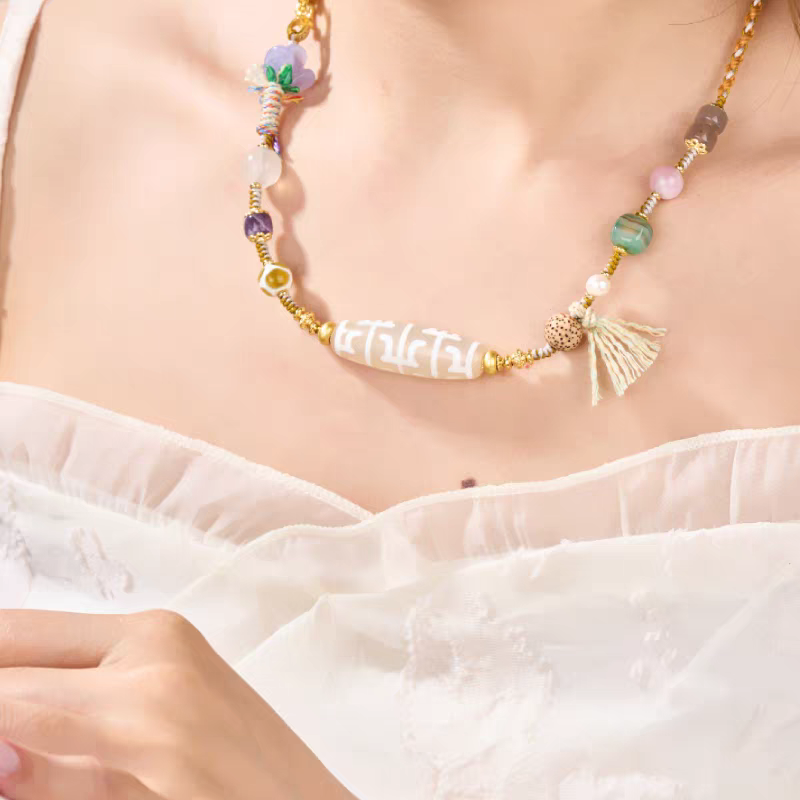  Handmade white urna Lotus Guru Dzi pendant, showcasing Buddhist sacrificial items art and authentic Tibetan Buddhist sacrificial implements culture.