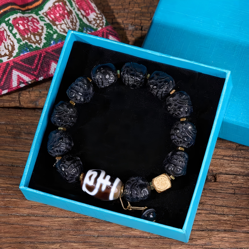 Authentic black wealth god Dzi bead bracelet representing Buddhist sacrificial items art within the Tibetan Buddhist sacrificial implements culture. Pure handmade natural agate jewelry.
