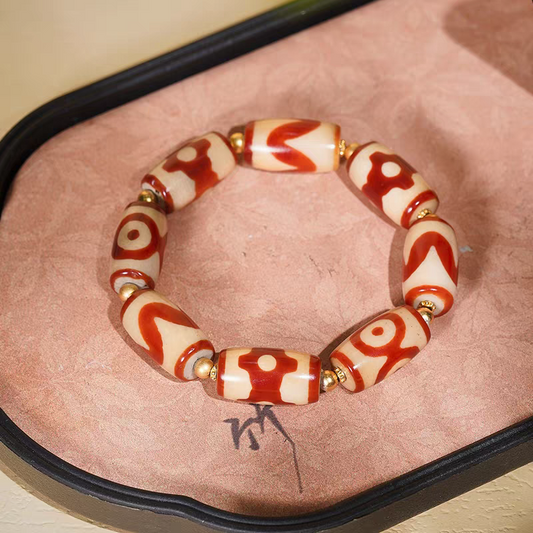 Tibetan Buddhist sacrificial implements culture small bucket red meat agate Dzi bracelet. Handcrafted from natural agate as a piece of Buddhist sacrificial items art.
