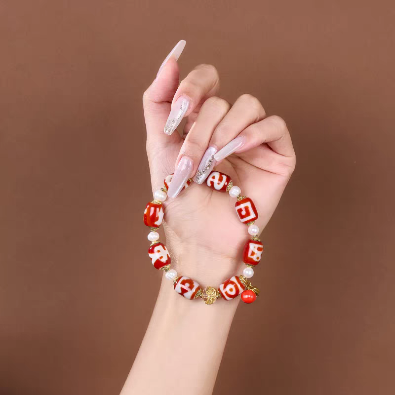  Authentic barrel-shaped red meat agate Dzi bead bracelet, showcasing Buddhist sacrificial items art and Tibetan Buddhist sacrificial implements culture. Purely handmade.