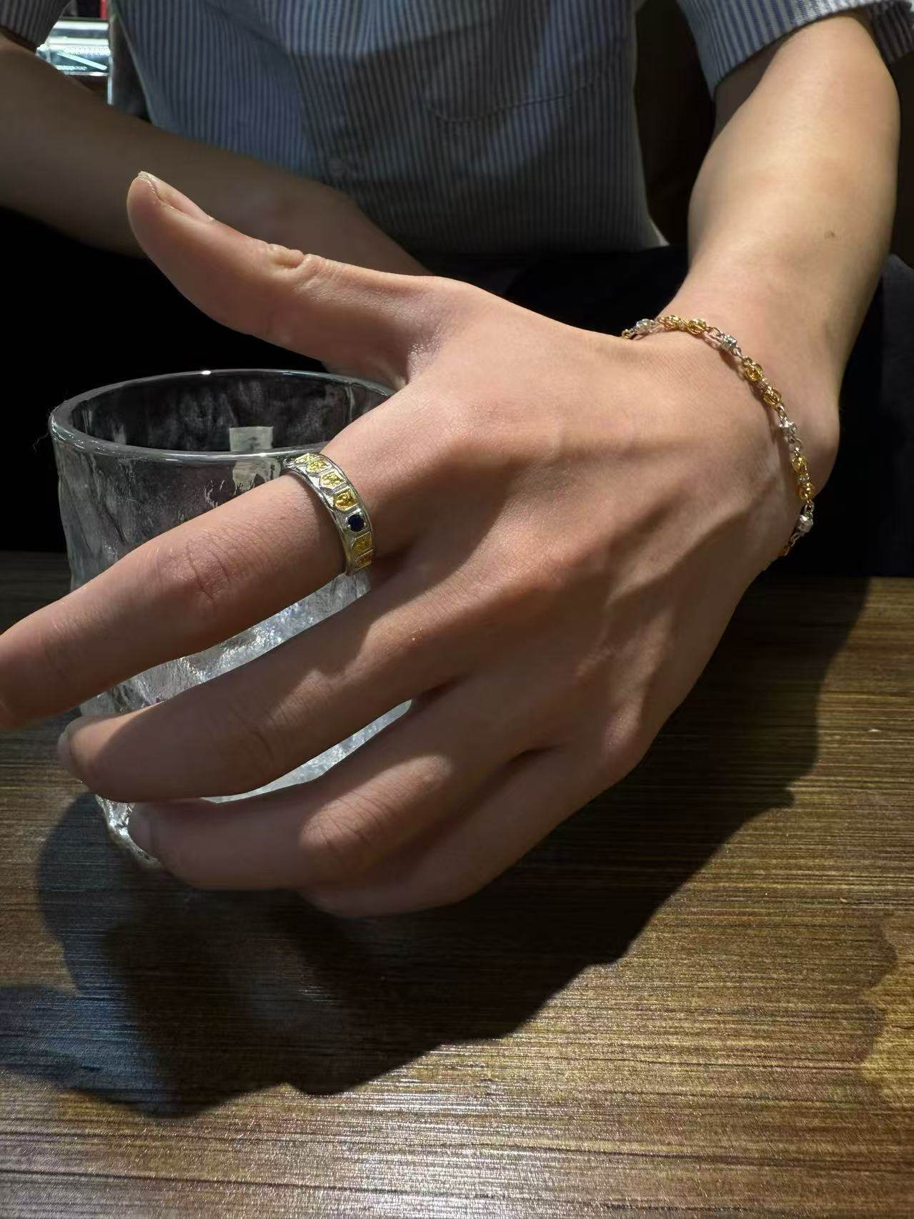 Buddhist sacrificial items art showcased through a hand-carved pure silver Dorje charm bracelet, representing the wisdom and power of Tibetan Buddhist culture.
