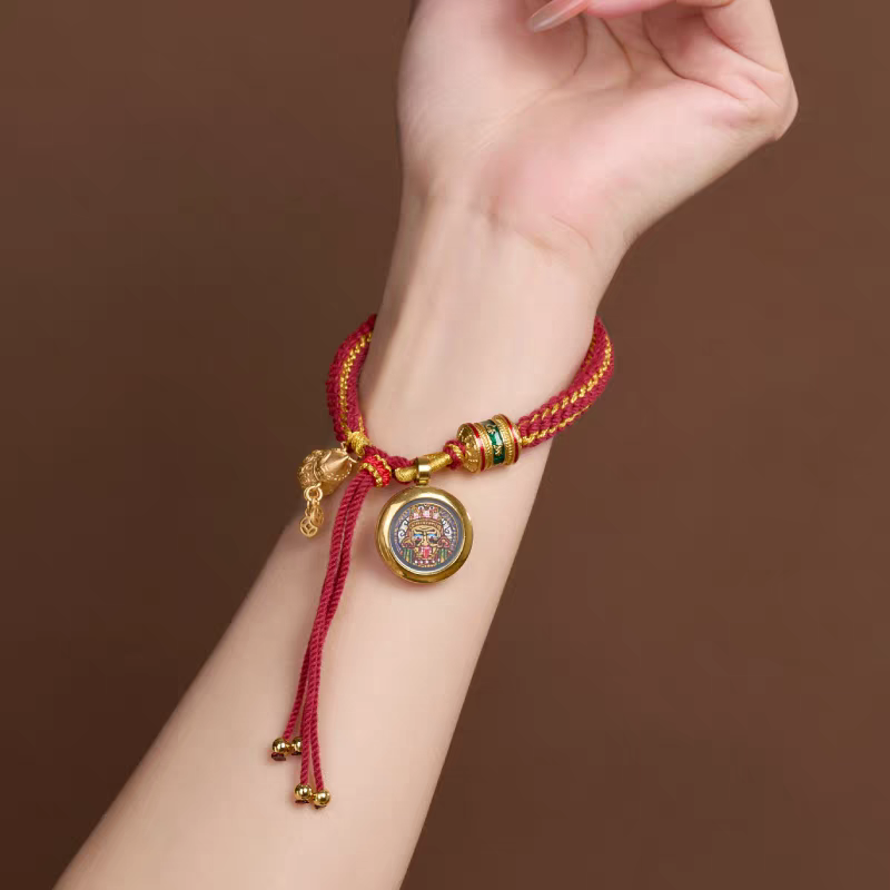 Authentic hand-painted Zaki Lhamo mini Thangka amulet bracelet, showcasing Buddhist sacrificial items art and Tibetan Buddhist sacrificial implements culture.
