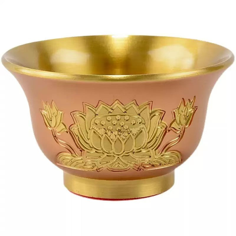 Tibetan Buddhist sacrificial implements culture: A set of seven lotus-shaped offering bowls engraved with the Eight Auspicious Symbols for daily water rituals.
