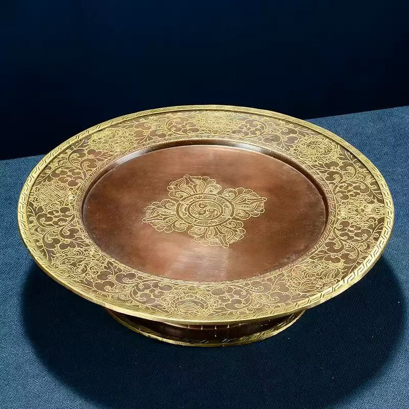 Buddhist sacrificial items art: A hand-engraved copper mandala with seven levels, symbolizing the offering of the universe's precious elements in Tibetan Buddhist sacrificial implements culture.
