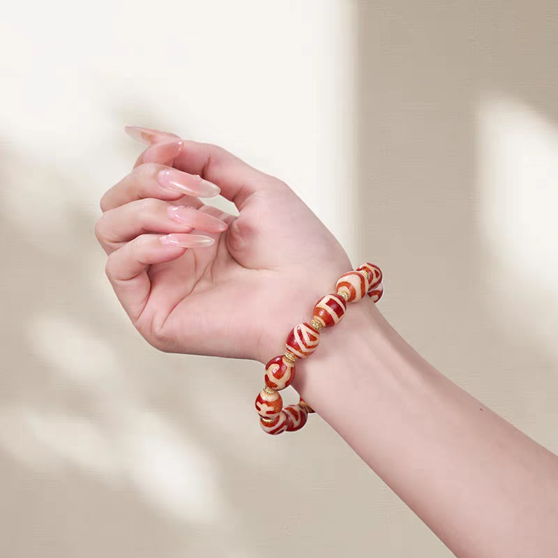  Darlok style natural red agate sacred Dzi bead jewelry. This spiritual piece embodies Tibetan Buddhist sacrificial implements culture and traditional art.