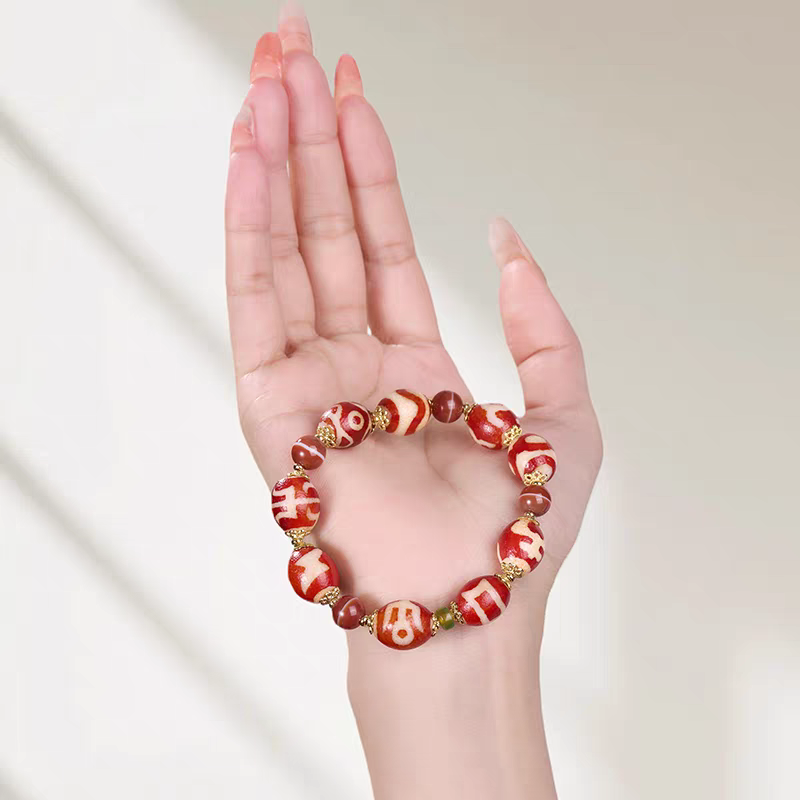 Exquisite multi-pattern natural red agate Dzi jewelry, a spiritual artifact rooted in Tibetan Buddhist sacrificial implements culture for success.
