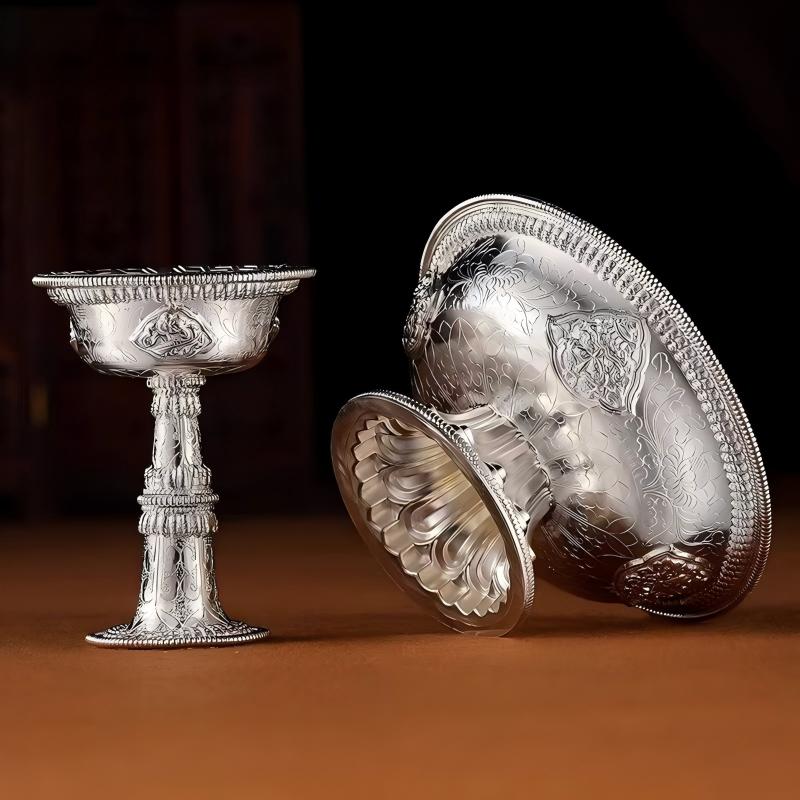Hand-carved pure silver Dharma protector cup featuring authentic Tibetan Buddhist sacrificial implements culture and intricate Buddhist sacrificial items art for altar worship.