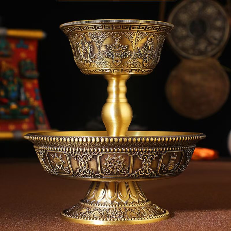 Buddhist sacrificial items art: A hand-engraved brass protector deity cup designed for sacred tea or wine offerings in traditional Tibetan rituals.
