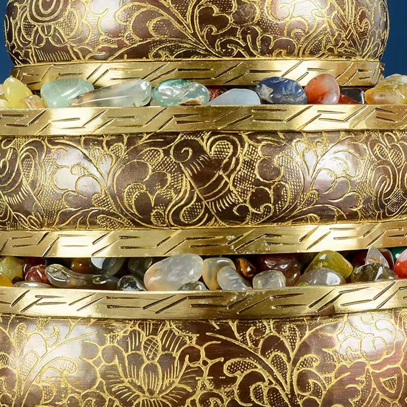 Tibetan Buddhist sacrificial implements culture: Sacred Himalayan Ashtamangala gemstone offering mandala used on an altar, representing spiritual abundance and peaceful protection.