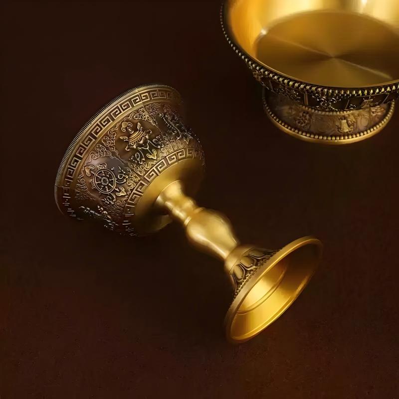 Tibetan Buddhist sacrificial implements culture: Sacred Himalayan brass ritual vessel with Eight Lucky Emblems, symbolizing merit accumulation and spiritual victory.