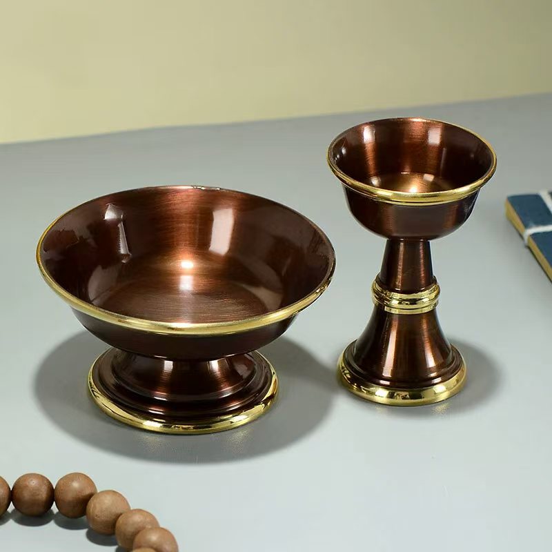 Tibetan Buddhist sacrificial implements culture: Sacred Himalayan brass ritual vessel with Eight Lucky Emblems, symbolizing merit accumulation and spiritual victory.
