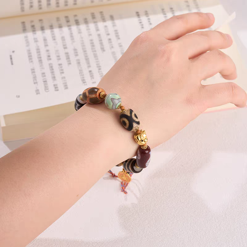  Handcrafted Darlok Dzi bracelet representing comprehensive achievement in Buddhist sacrificial items art and ancient traditions.