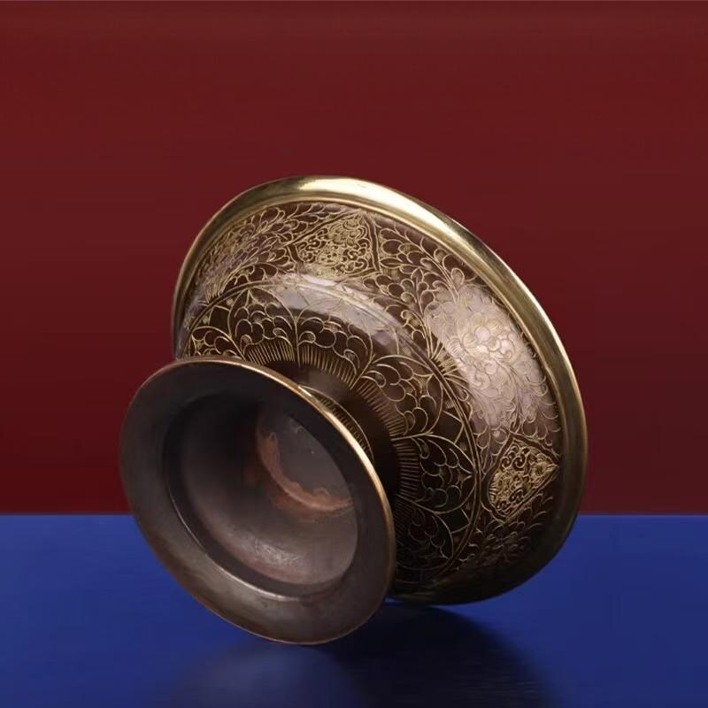 Hand-carved purple copper ritual chalice from the Tibetan Buddhist sacrificial implements culture, featuring traditional Nepal metalwork as a premium Buddhist sacrificial items art.