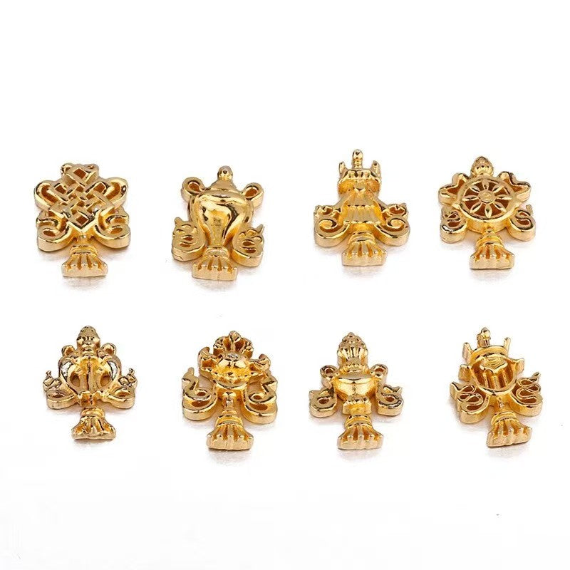 Hand-carved pure silver Ashtamangala (Eight Auspicious Signs) set from the Tibetan Buddhist sacrificial implements culture, designed as a premium Buddhist sacrificial items art for merit accumulation.