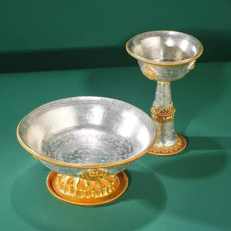Buddhist sacrificial items art: A handmade two-tone gold and silver protector deity cup, designed for daily sacred tea or wine offerings in traditional Himalayan rituals. 