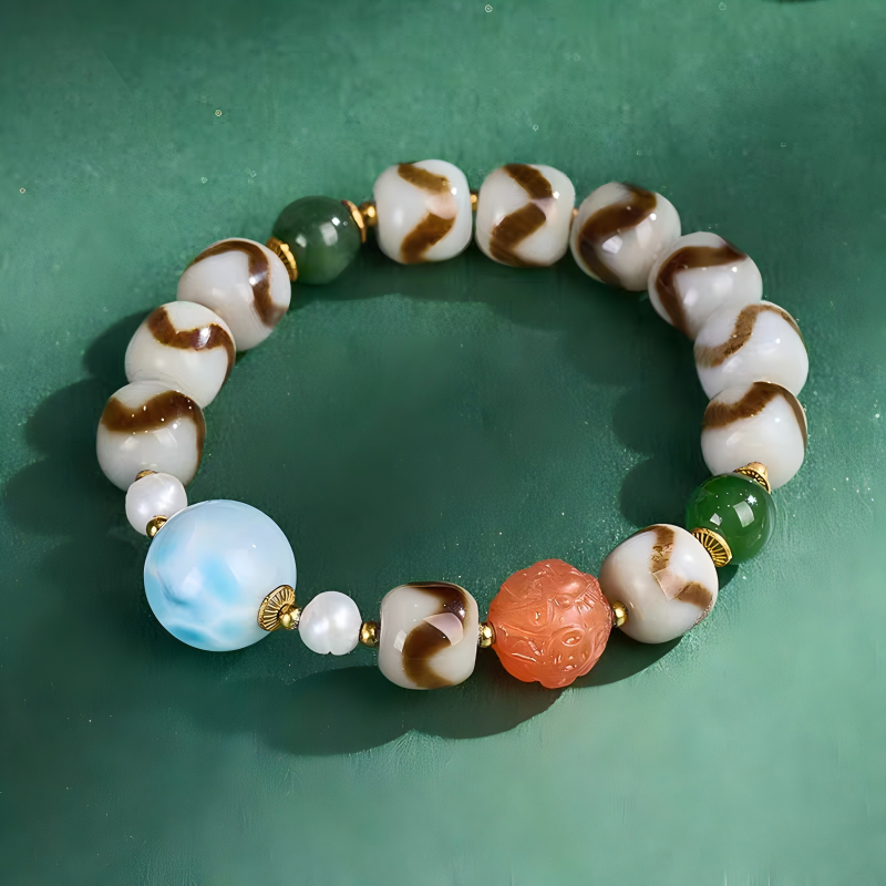 Purely handmade Larimar and Tiger Tooth Darlok style Dzi beads. A high-value wearable artifact of Tibetan Buddhist sacrificial implements culture.