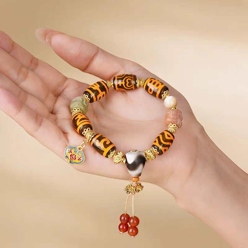  Handcrafted Tibetan Dzi bracelet with barley beads, representing abundance in Buddhist sacrificial items art and ancient traditions.