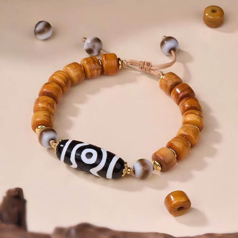 Tibetan Buddhist sacrificial implements culture Panda black and white three-eyed Dzi bracelet. Handcrafted from natural agate as a piece of Buddhist sacrificial items art.