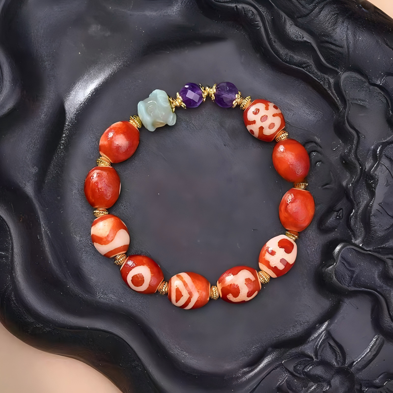 Authentic red agate multi-totem Dzi beads. A high-quality wearable artifact of Tibetan Buddhist sacrificial implements culture and Buddhist sacrificial items art.

