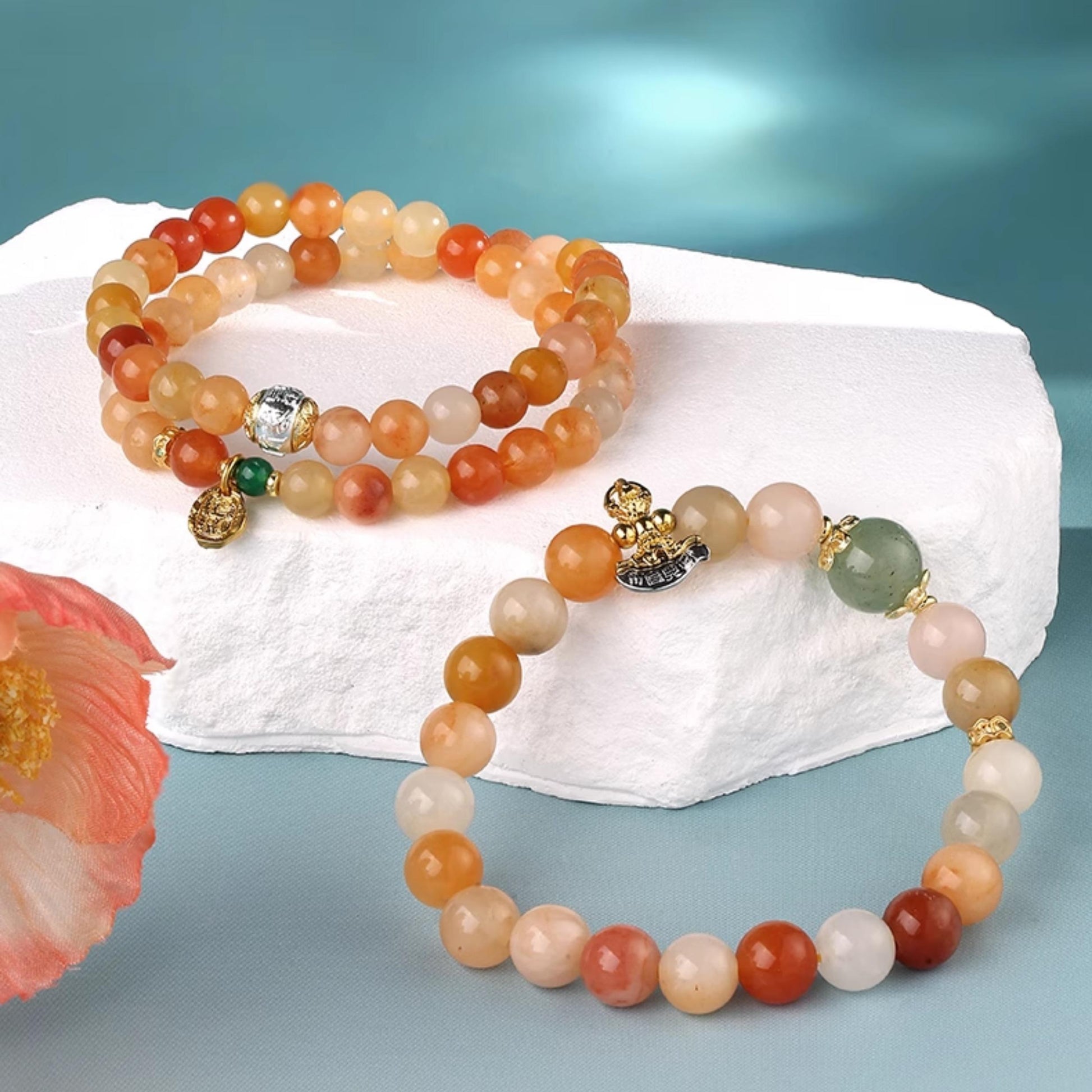 Beautiful multi-wrap bracelet combining sandalwood and golden silk jade. This handcrafted piece embodies Tibetan Buddhist traditions, offering peace and protection.