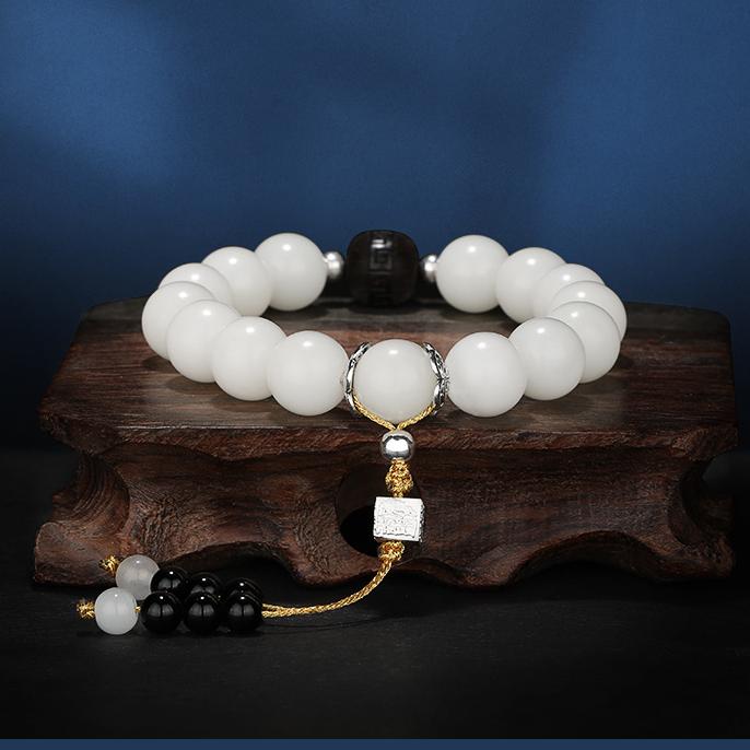 Enlightenment Wood Mala combining white bodhi root with carved wood beads. This jewelry culture represents authentic Tibetan Buddhist meditation practices.