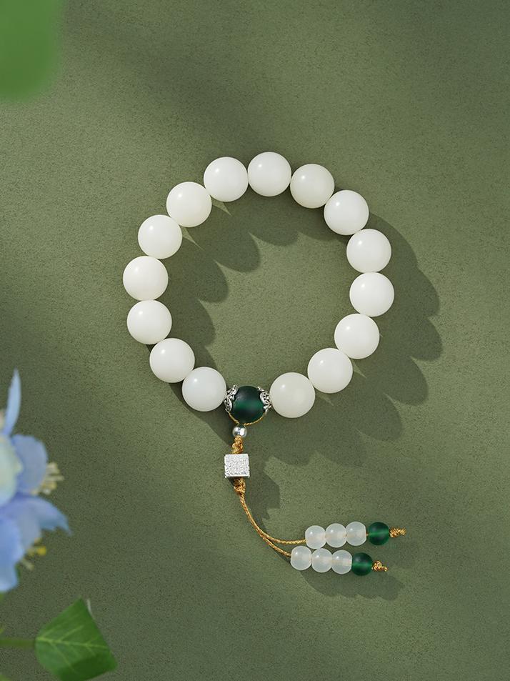 White Bodhi Root Mala handcrafted with lapis lazuli beads and copper elements. This Tibetan Buddhist jewelry culture piece embodies traditional Himalayan craftsmanship for meditation practice.