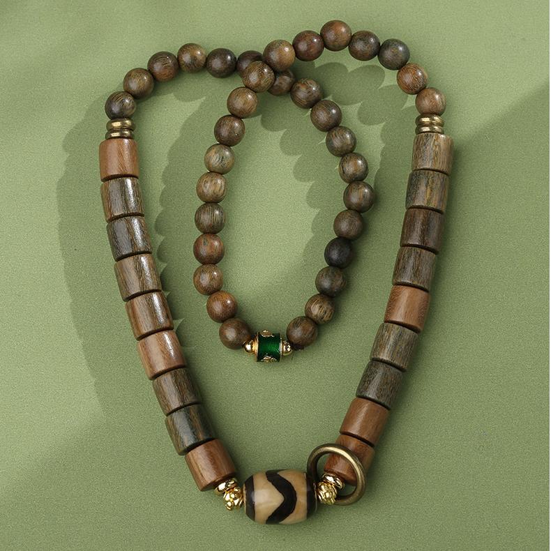 Sandalwood agate tooth bead bracelet representing authentic Tibetan Buddhist jewelry art. Handcrafted with copper details for spiritual protection and practice.