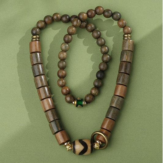 Sandalwood agate tooth bead bracelet representing authentic Tibetan Buddhist jewelry art. Handcrafted with copper details for spiritual protection and practice.