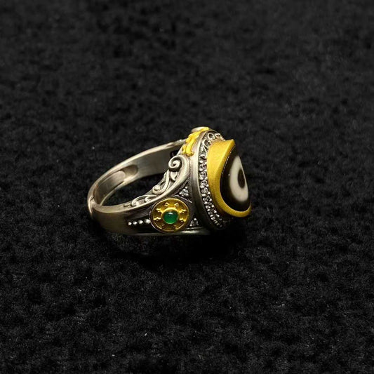 Tibetan Buddhist jewelry culture embodied in a S925 silver Golden Wheel ring featuring sacred Dharma symbols, representing the Buddhist teachings in fine jewelry art.

