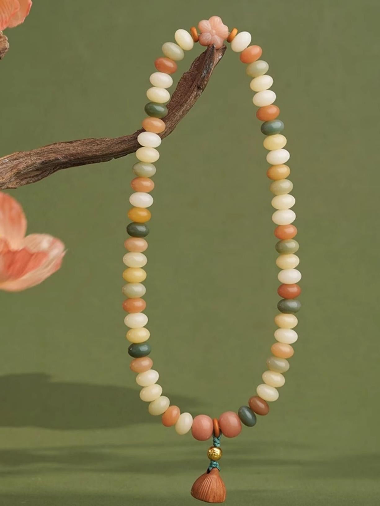 Enlightenment Bodhi strand handcrafted with 925 silver ornaments and natural jujube wood beads. This Tibetan Buddhist jewelry art piece supports spiritual awakening in authentic Himalayan tradition.