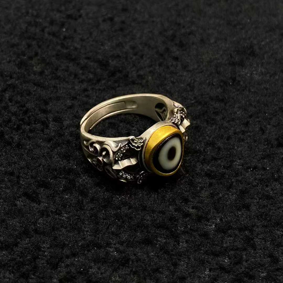 A masterpiece of Tibetan Buddhist jewelry art, this sterling silver dorje ritual ring showcases exquisite inlaid craftsmanship for spiritual practice.