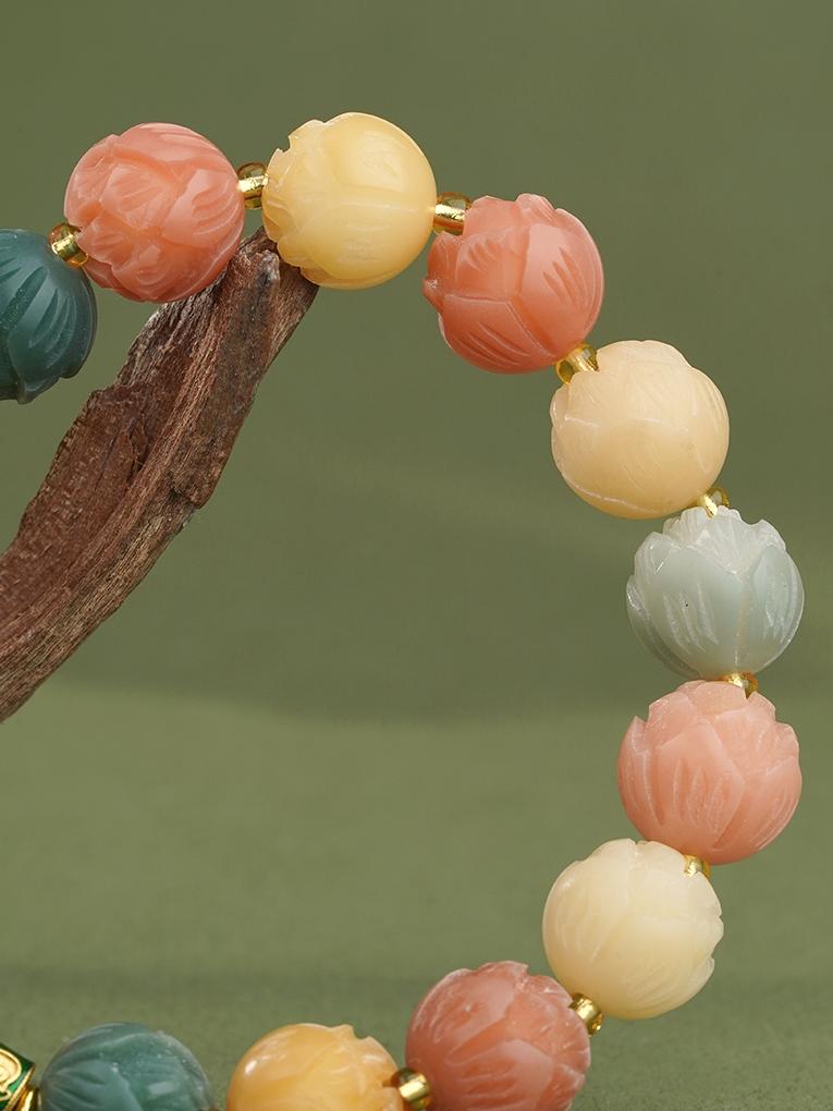 Illumination Bodhi mala handmade with copper ornaments and clear quartz. Represents Tibetan Buddhist jewelry art tradition for meditation practice.