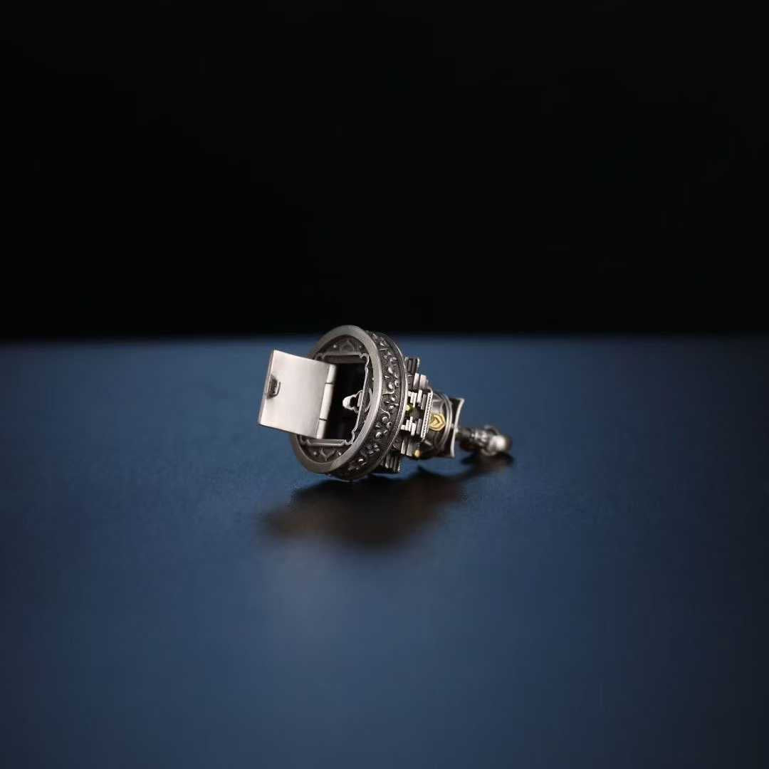 A masterpiece of Tibetan Buddhist jewelry art, this sterling silver meditation pendant features an exquisitely inlaid sand mandala design symbolizing impermanence and spiritual harmony.