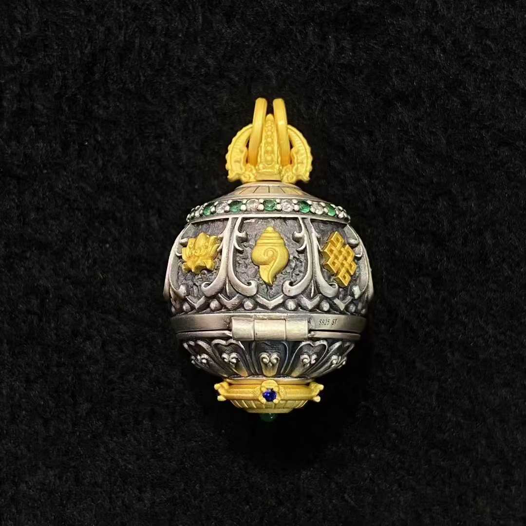 Explore Tibetan Buddhist jewelry culture with this fine-crafted silver pendant, uniting Shakyamuni Buddha with the complete Ashtamangala set for a powerful spiritual amulet.