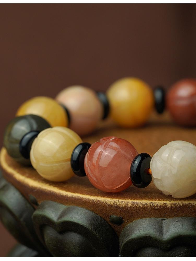 Golden Jade spiritual bracelet featuring round beads and obsidian elements. This Tibetan Buddhist jewelry art creation combines natural stones with sacred craftsmanship for daily wear.