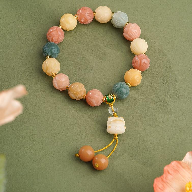 Handmade Tibetan Buddhist mala featuring natural Bodhi seeds, glass, and clear quartz crystals. This sacred jewelry art represents the path to enlightenment in Tibetan Buddhist tradition.