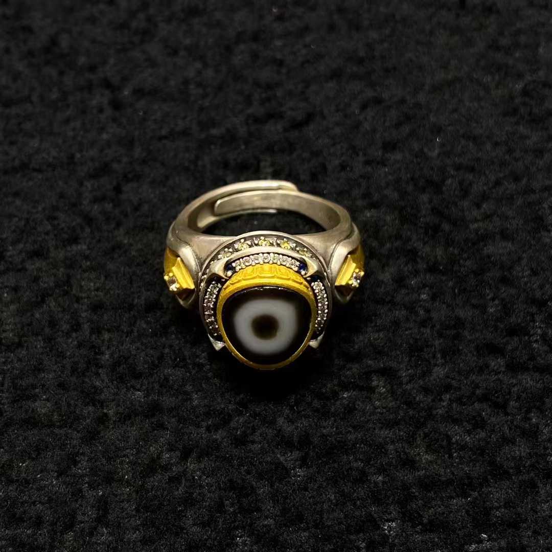 Meticulously inlaid cosmic star ring in S925 silver demonstrates Tibetan Buddhist jewelry art, featuring sacred celestial motifs for spiritual practitioners.