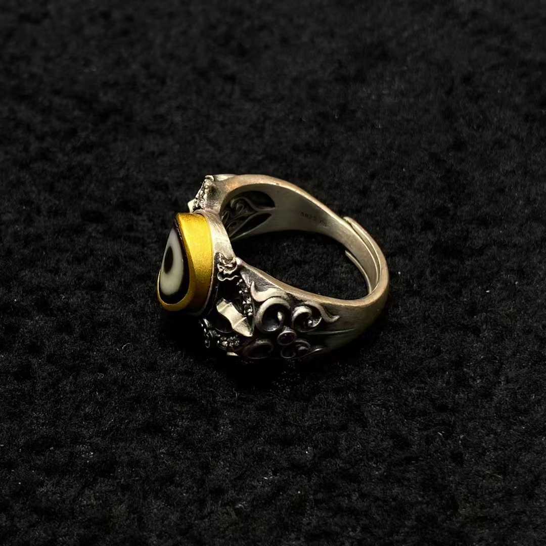 Meticulously inlaid ritual vajra ring in S925 silver demonstrates Tibetan Buddhist jewelry art, embodying enlightenment through sacred craftsmanship.