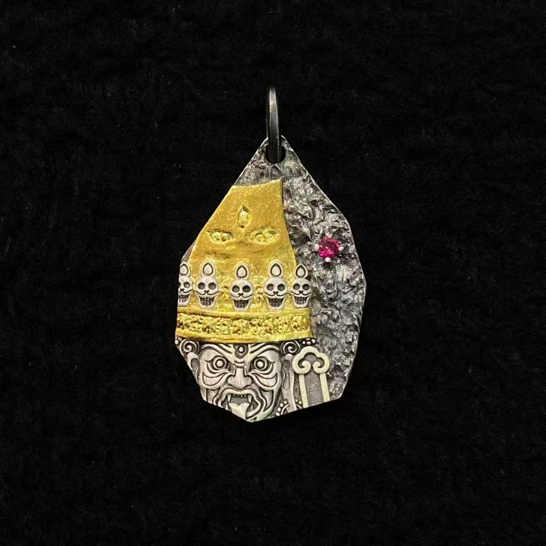  Meticulously inlaid Dharma Protector Shri Devi pendant in gold and silver demonstrates Tibetan Buddhist jewelry art, embodying sacred feminine guardianship through detailed metalwork.